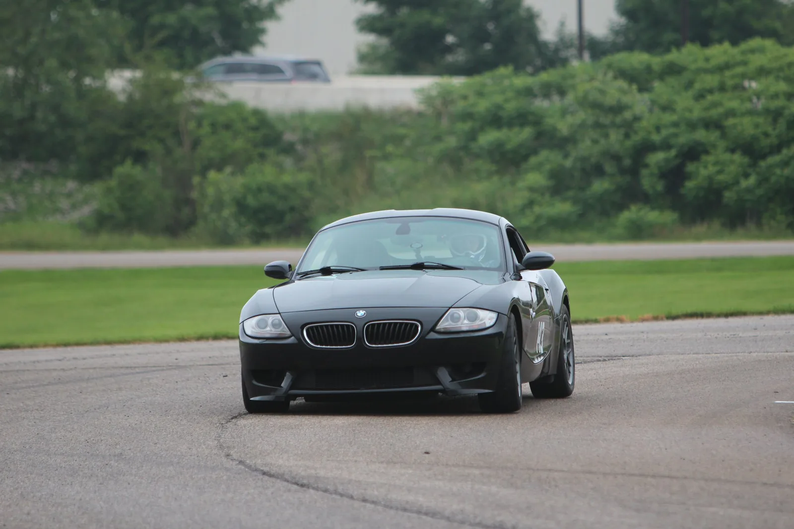 Black specialty auto set up for controlled performance driving on pavement.