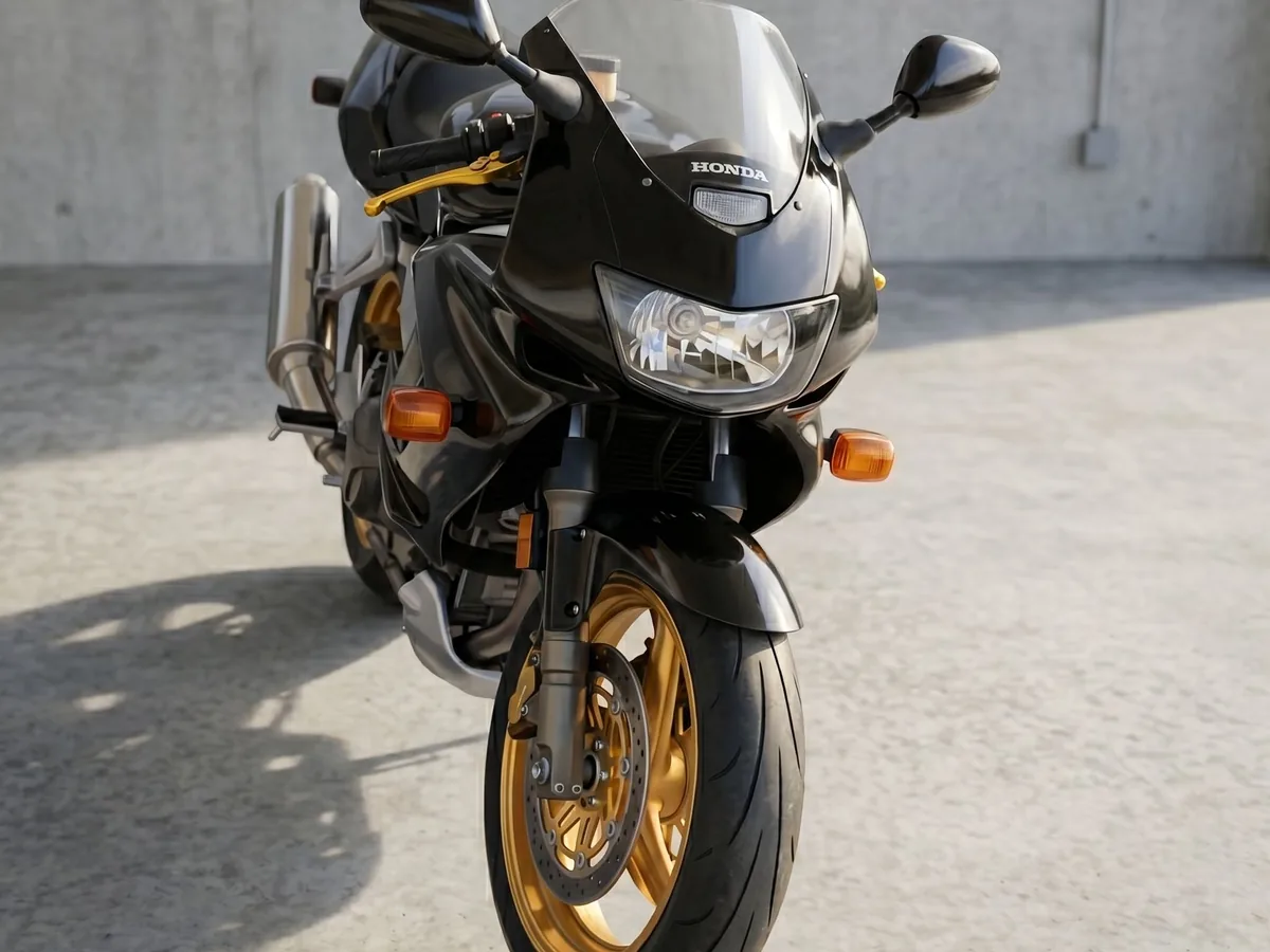 Black sport motorcycle detail photographed from the front.