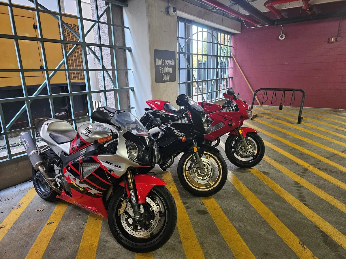 Group of sport motorcycles staged for service-focused detail imagery.